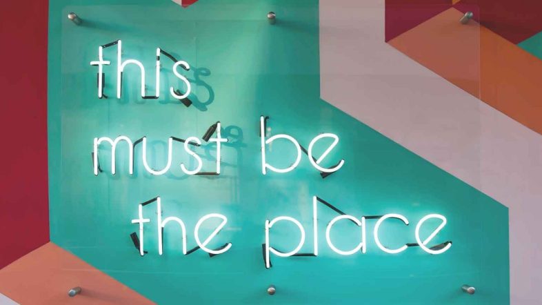 A neon sign "This must be the place""